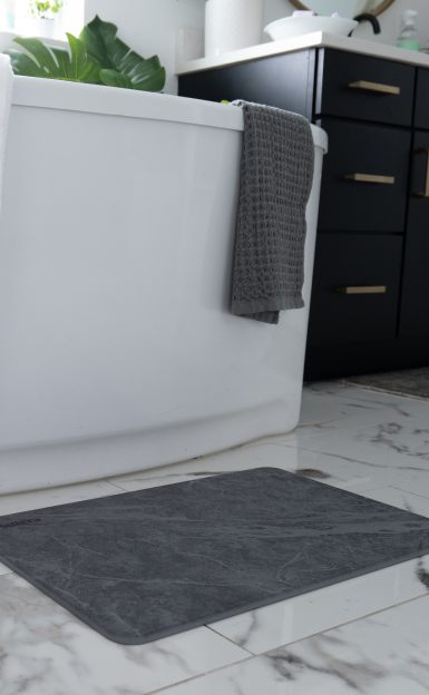 decorative bathroom with silverthread towel hung on a towel hook.